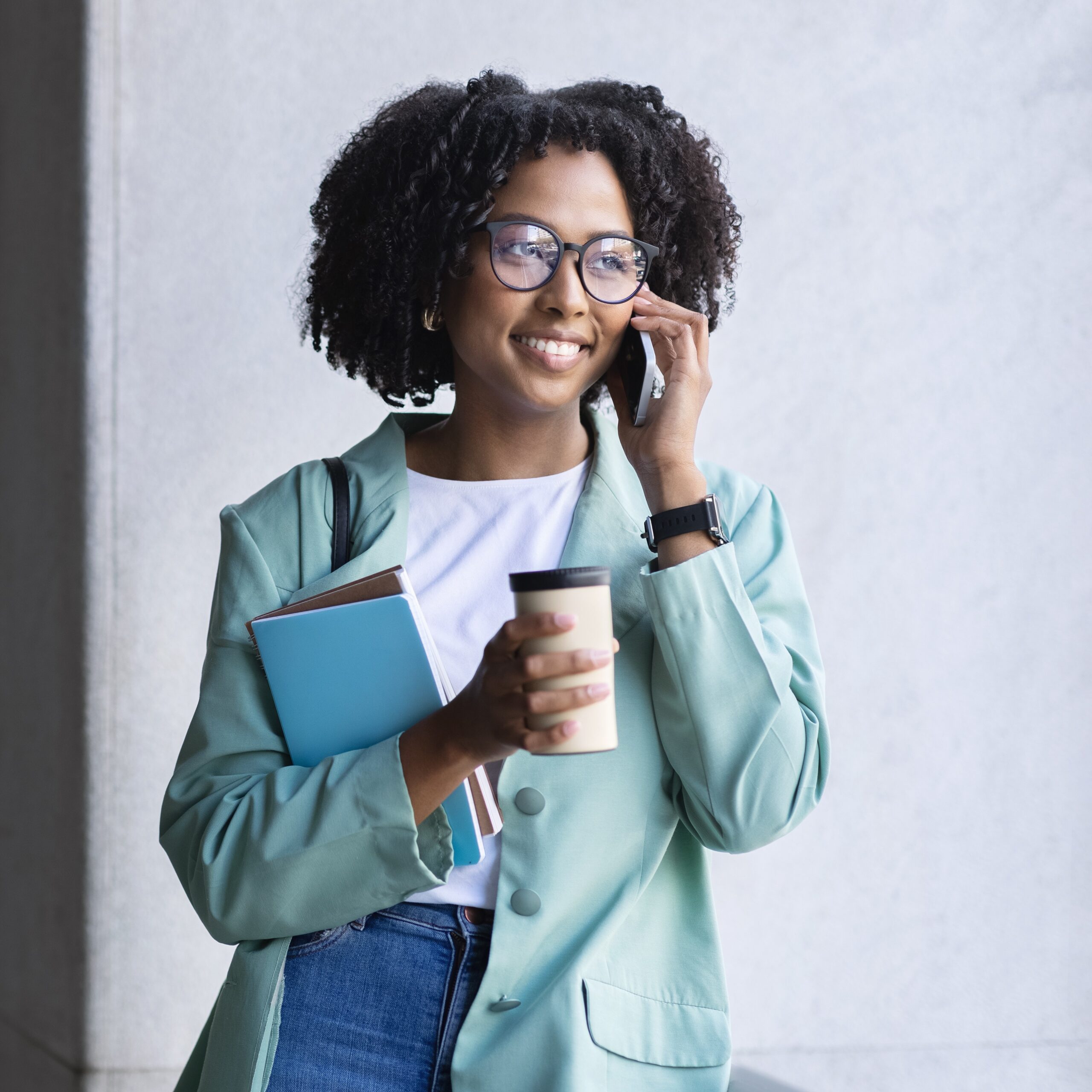 Happy Young Black Woman Employee Have Phone Call On Street A woman searching on her phone "I have taken the abortion pill but changed my mind. Is it too late?"